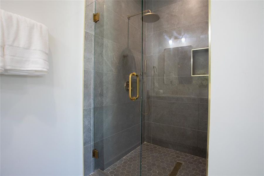 Bathroom featuring a shower with shower door