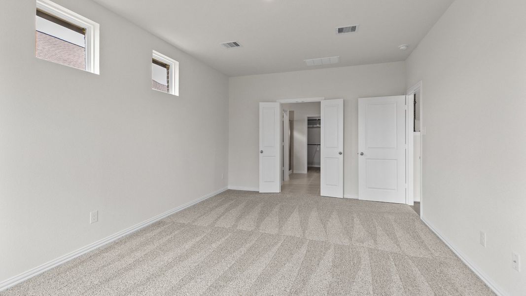 Representative furnished interior of a home built from the Southfork by Brightland Homes in Sunterra, Katy (Image 11).