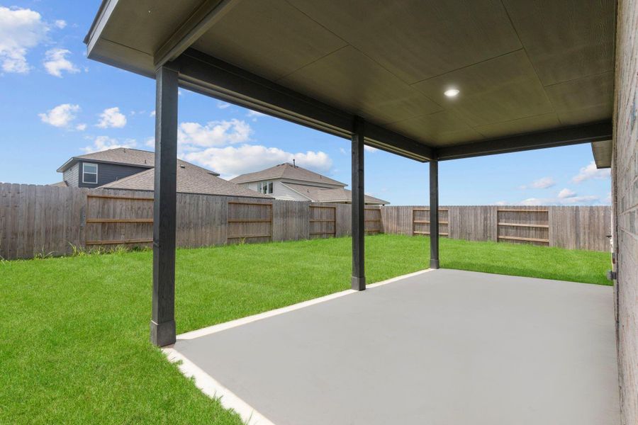 Alternate angle of the covered patio highlighting its generous size and direct access from the main living areas. Alternate angle of the covered patio highlighting its generous size and direct access from the main living areas.