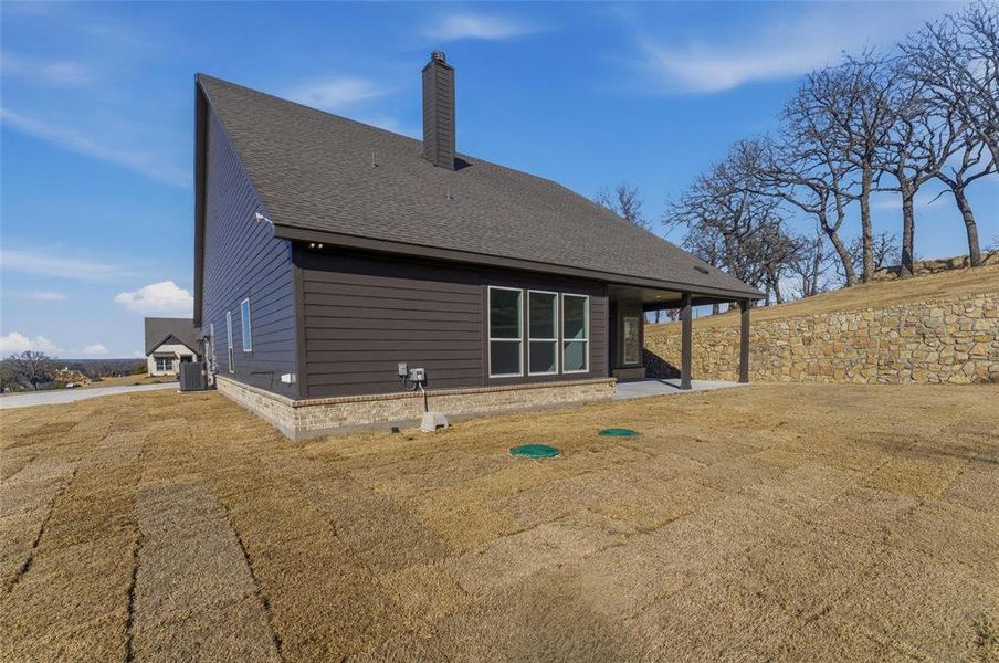 Exterior details and patio area of a home in Oak Grove Addition, Springtown (Image 3).