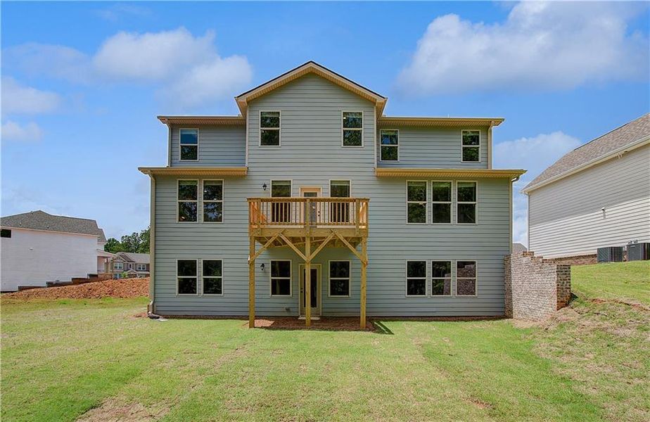 Front exterior of a new home in Kingston, Locust Grove, GA, highlighting curb appeal (Image 1).