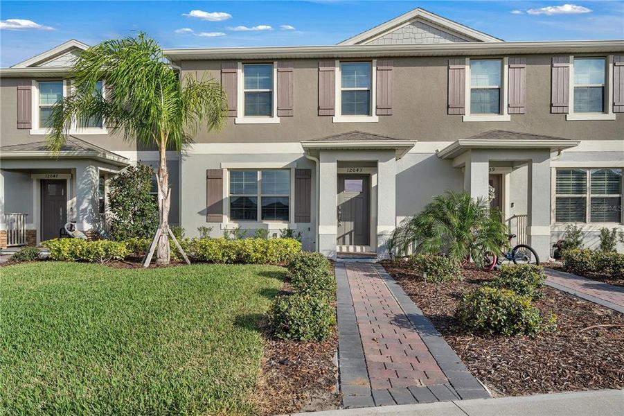 Front exterior of a new home in , Winter Garden, FL, highlighting curb appeal (Image 17).