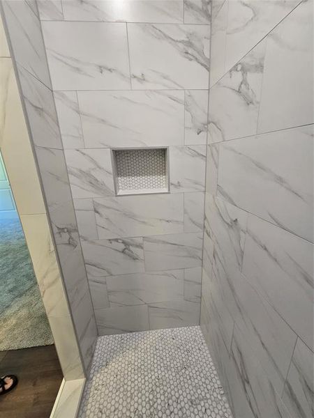 Bathroom with a tile shower