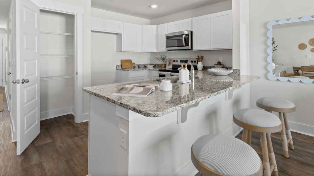 Furnished interior view inside a new home in Waterside Townhomes, Surf City (Image 12).