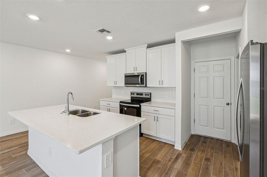 Furnished interior view inside a new home in The Meadow at Crossprairie Townes, St. Cloud (Image 5).