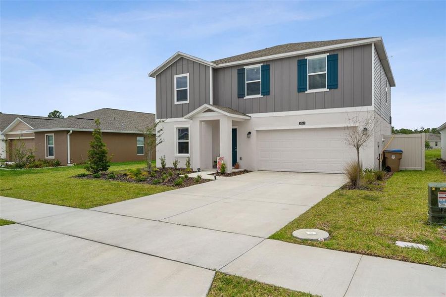 Front exterior of a new home in , Kissimmee, FL, highlighting curb appeal (Image 20).