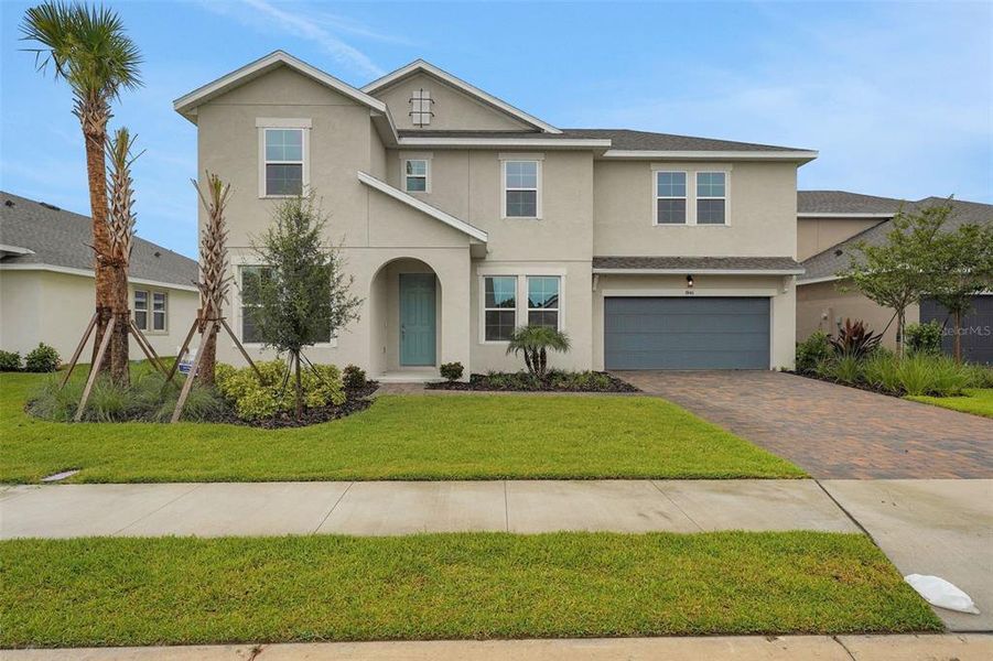 Front exterior of a new home in Seaire, Parrish, FL, highlighting curb appeal (Image 21).