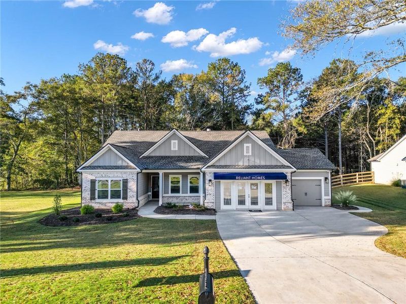 Front exterior of a new home in Belle Woode Estates, Monroe, GA, highlighting curb appeal (Image 2). Front exterior of a new home in Belle Woode Estates, Monroe, GA, highlighting curb appeal (Image 2).