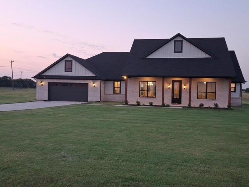Front exterior of a new home in , Van Alstyne, TX, highlighting curb appeal (Image 17).