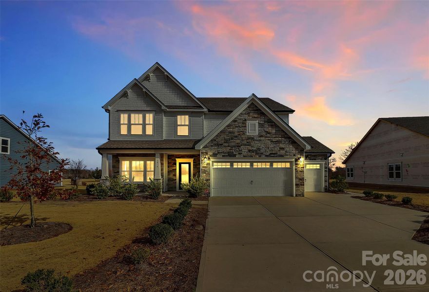 Front exterior of a new home in Stonebridge Fairways, Monroe, NC, highlighting curb appeal (Image 20).