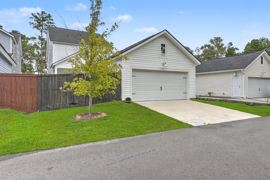 Front exterior of a new home in Limehouse Village: Row Collection, Summerville, SC, highlighting curb appeal (Image 26).