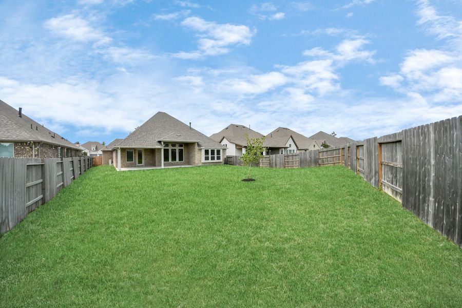 Front exterior of a new home in ARTAVIA: Hilltop Collection, Conroe, TX, highlighting curb appeal (Image 23). Front exterior of a new home in ARTAVIA: Hilltop Collection, Conroe, TX, highlighting curb appeal (Image 23).