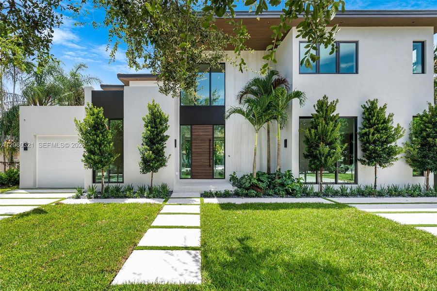 Front exterior of a new home in , Miami Shores, FL, highlighting curb appeal (Image 33). Front exterior of a new home in , Miami Shores, FL, highlighting curb appeal (Image 33).