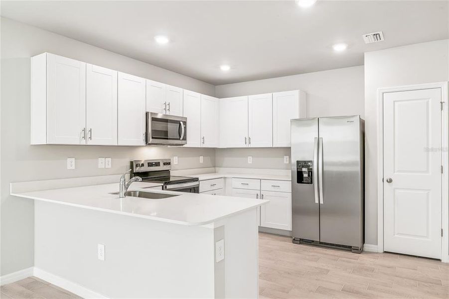 Furnished interior view inside a new home in Heritage Lake Park, Punta Gorda (Image 5).