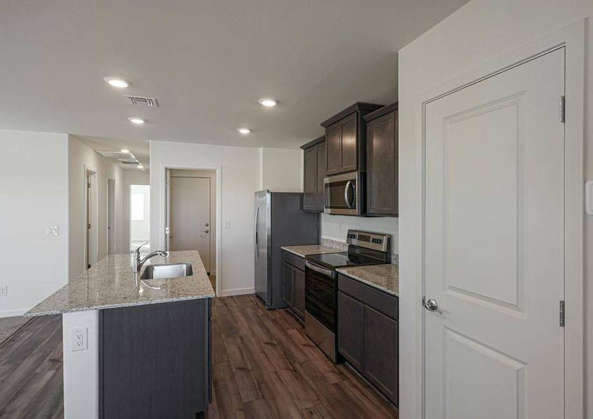 The kitchen comes with a full suite of energy-efficient appliances!