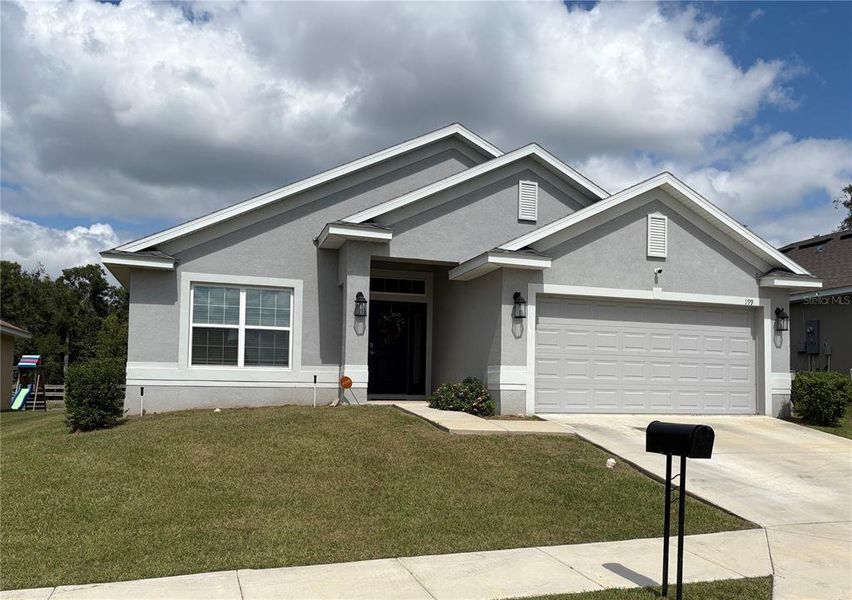 Front exterior of a new home in , Ocala, FL, highlighting curb appeal (Image 1). Front exterior of a new home in , Ocala, FL, highlighting curb appeal (Image 1).