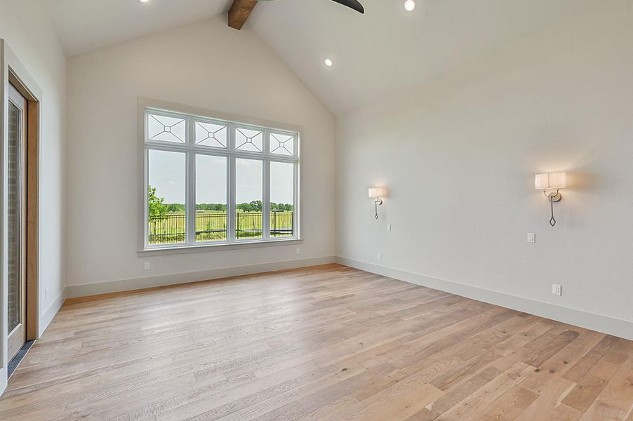 Huge windows in Master bedroom that overlooks beautiful back yard