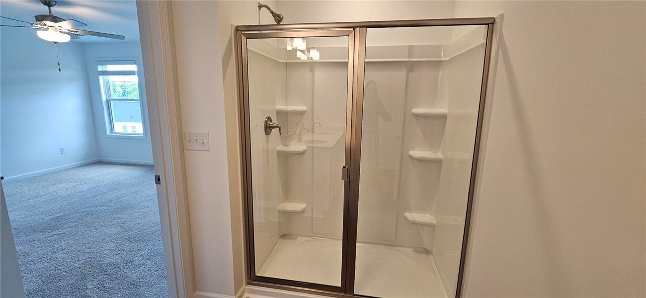 This spacious bathroom offers a convenient shower, This spacious bathroom offers a convenient shower,