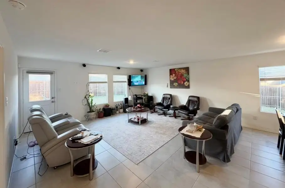 Living room with light tile patterned floors