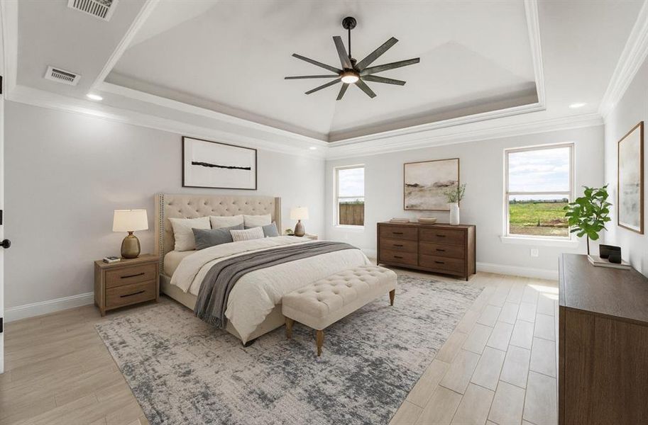Bedroom featuring a tray ceiling, ornamental molding, light wood-style flooring, ceiling fan, and recessed lighting