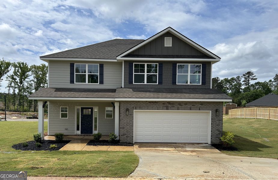 Front exterior of a new home in Barrington Place, Macon, GA, highlighting curb appeal (Image 1). Front exterior of a new home in Barrington Place, Macon, GA, highlighting curb appeal (Image 1).