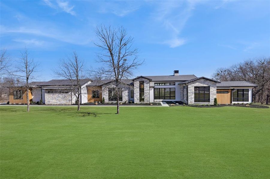 Front exterior of a new home in , Aledo, TX, highlighting curb appeal (Image 26). Front exterior of a new home in , Aledo, TX, highlighting curb appeal (Image 26).