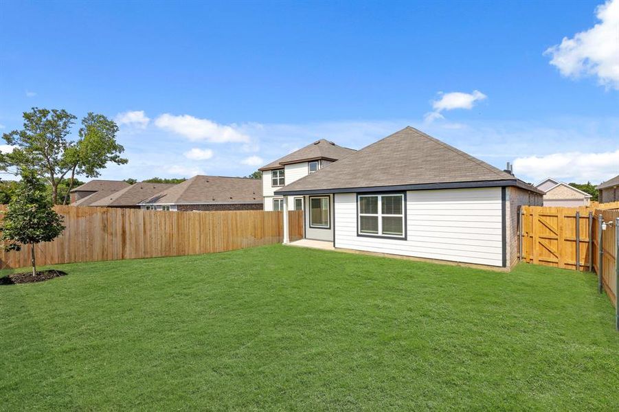 Front exterior of a new home in Christian Meadows, Ennis, TX, highlighting curb appeal (Image 2). Front exterior of a new home in Christian Meadows, Ennis, TX, highlighting curb appeal (Image 2).
