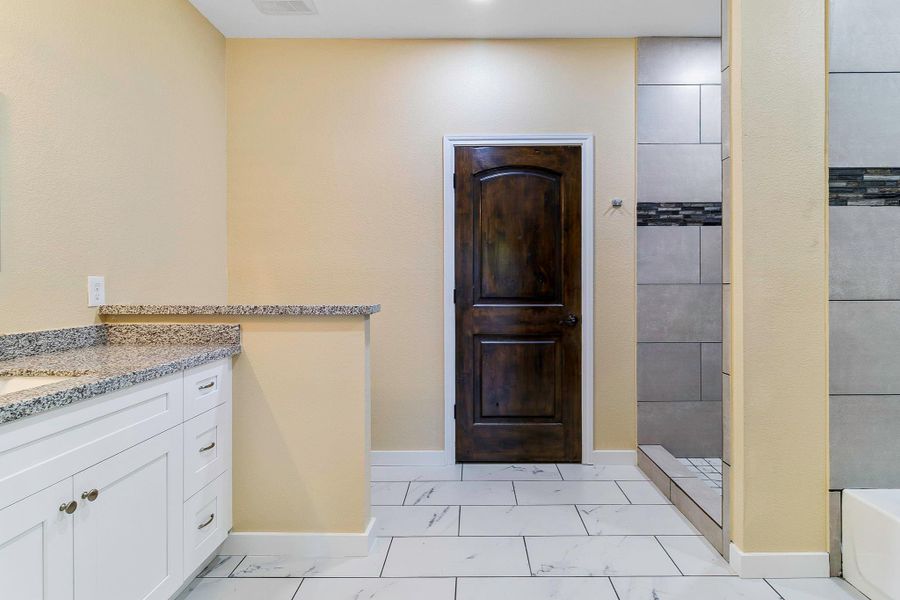 Large walk-in closet behind that real wooden door. Large walk-in closet behind that real wooden door.