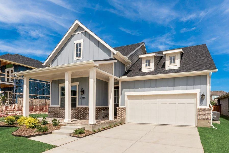 Front exterior of a new home in Bayside, Rowlett, TX, highlighting curb appeal (Image 25).