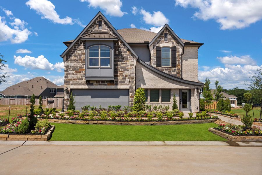 Front exterior of a new home in Woodforest, Montgomery, TX, highlighting curb appeal (Image 25). Front exterior of a new home in Woodforest, Montgomery, TX, highlighting curb appeal (Image 25).
