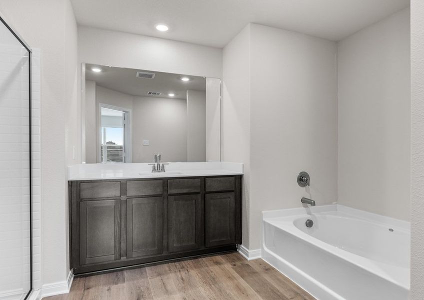 The master bathroom has a large garden tub. The master bathroom has a large garden tub.