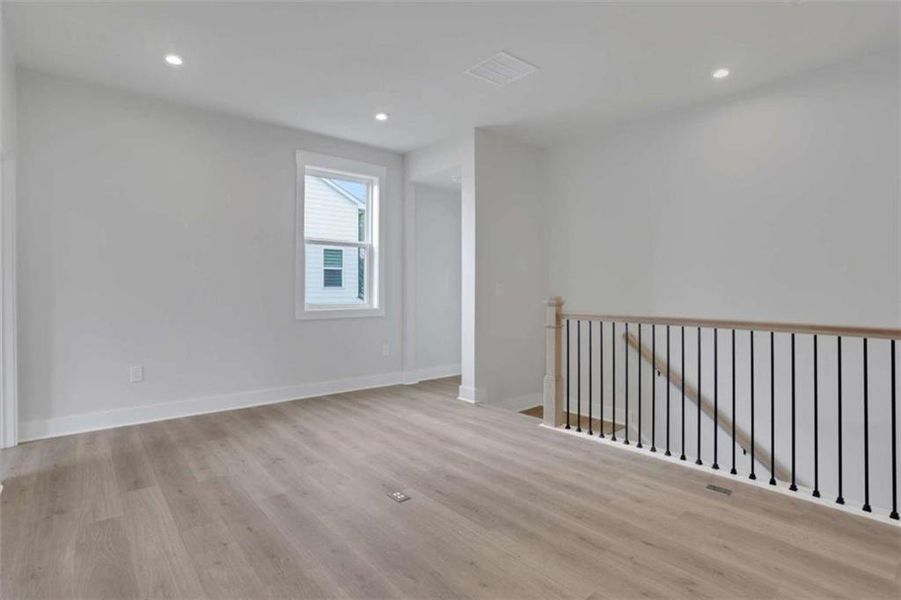 Spacious, unfurnished interior of a new home in The Paddocks at Doc Hughes, Buford (Image 43).