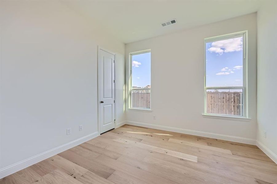 Unfurnished room featuring light hardwood / wood-style flooring