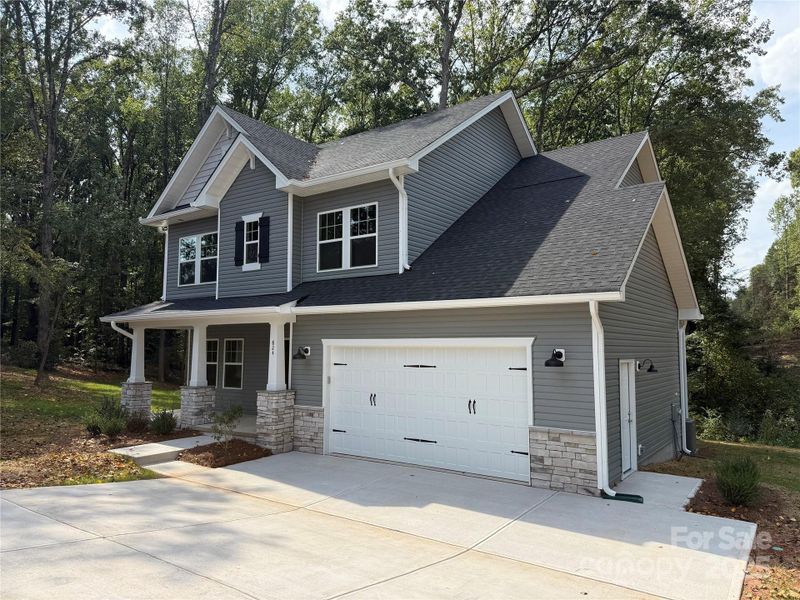 Front exterior of a new home in , Statesville, NC, highlighting curb appeal (Image 22).