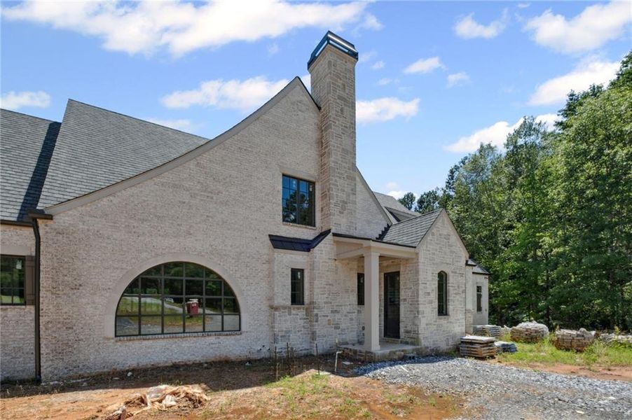 Front exterior of a new home in , Milton, GA, highlighting curb appeal (Image 21).