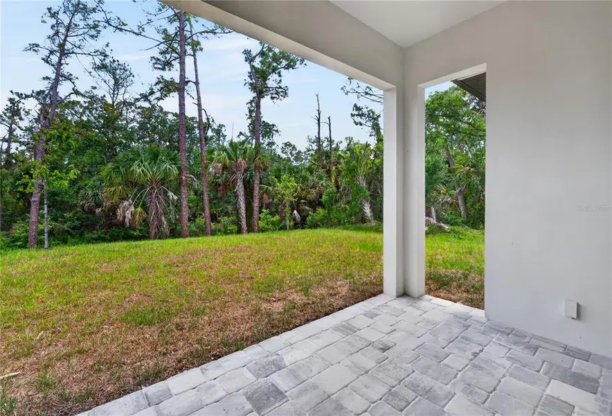 Exterior details and patio area of a home in , North Port (Image 44).