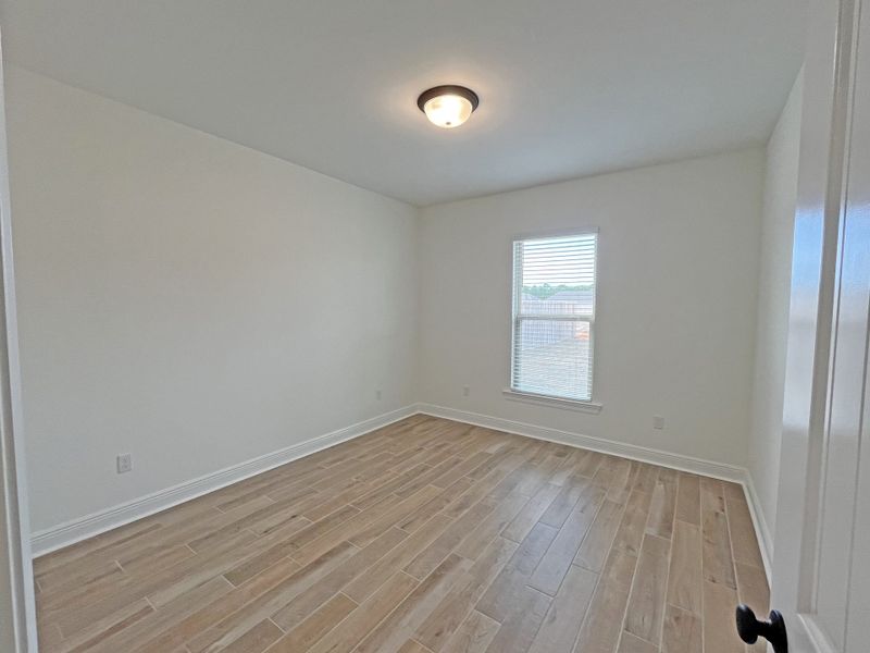 Spacious, unfurnished interior of a new home in Bird Song at Hammock Bay, Freeport (Image 19).