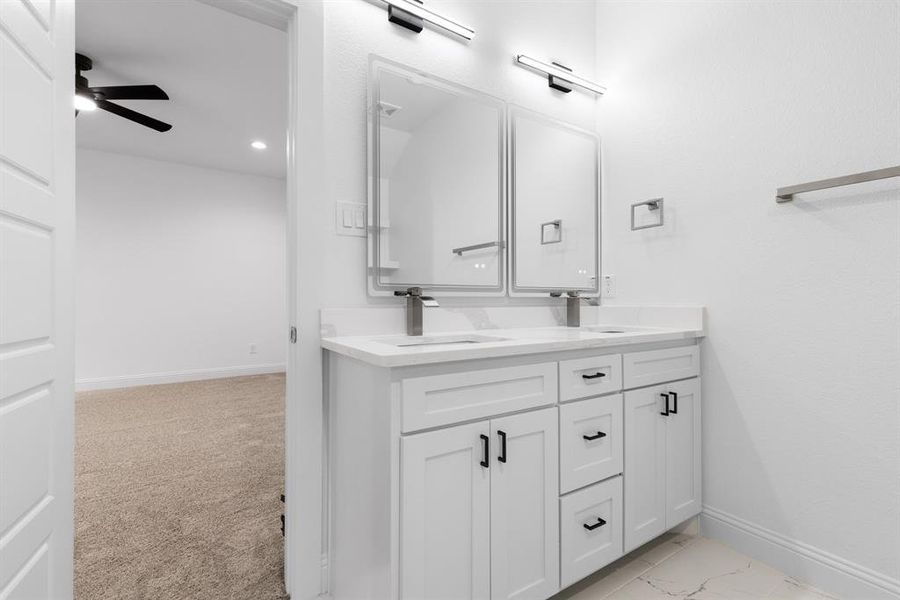 Bathroom with ceiling fan and vanity