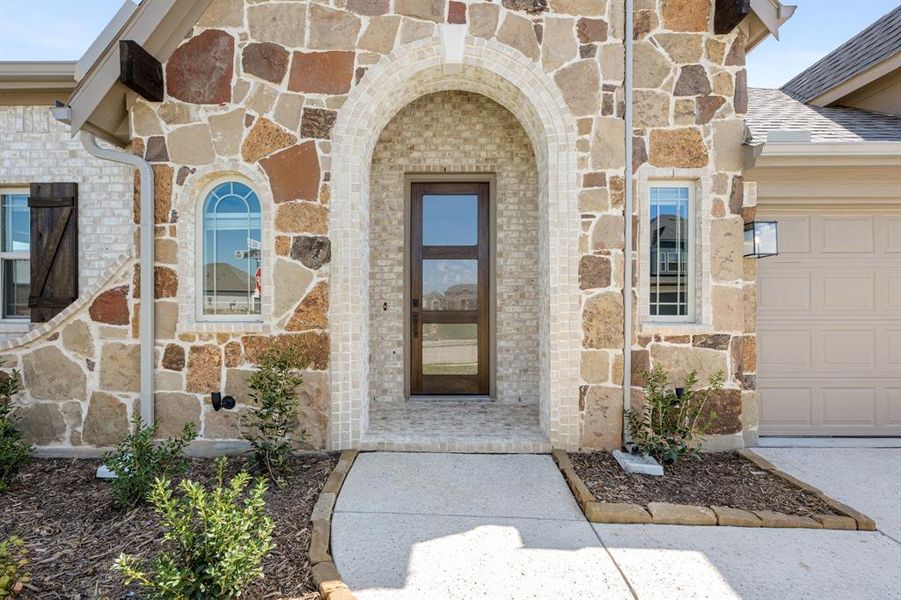 Exterior details and patio area of a home in Timberbrook 3B-4A, Justin (Image 17).