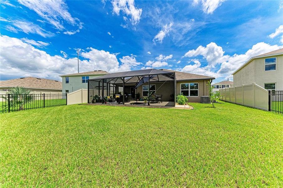 Exterior details and patio area of a home in Bella Lago, Parrish (Image 24).