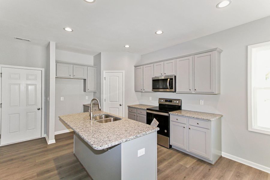 Representative furnished interior of a home built from the Nicklaus by RiverWILD Homes in Riverwood Ranch, Clayton (Image 11).