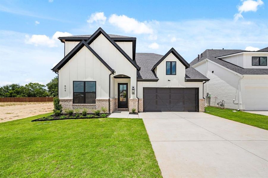 Front exterior of a new home in Parks of Aledo, Aledo, TX, highlighting curb appeal (Image 2).