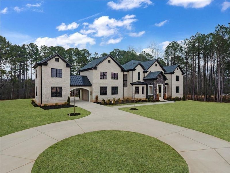Front exterior of a new home in , Milton, GA, highlighting curb appeal (Image 31). Front exterior of a new home in , Milton, GA, highlighting curb appeal (Image 31).