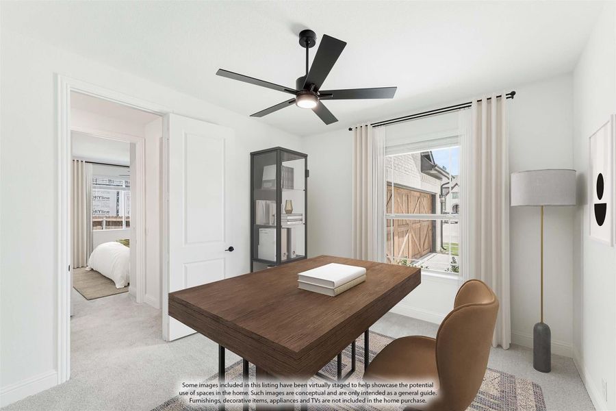 Home office with wood desk, ceiling fan, and window with natural light
