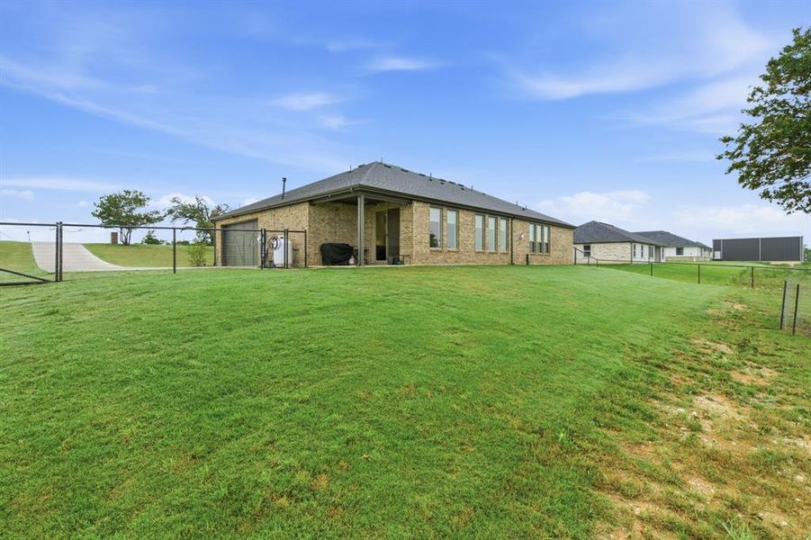 Exterior details and patio area of a home in Gatlin Ranch, Springtown (Image 3).