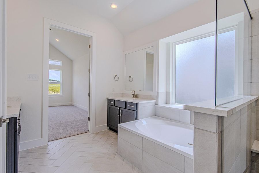 Another angle of the primary bath showcasing its spacious configuration Another angle of the primary bath showcasing its spacious configuration
