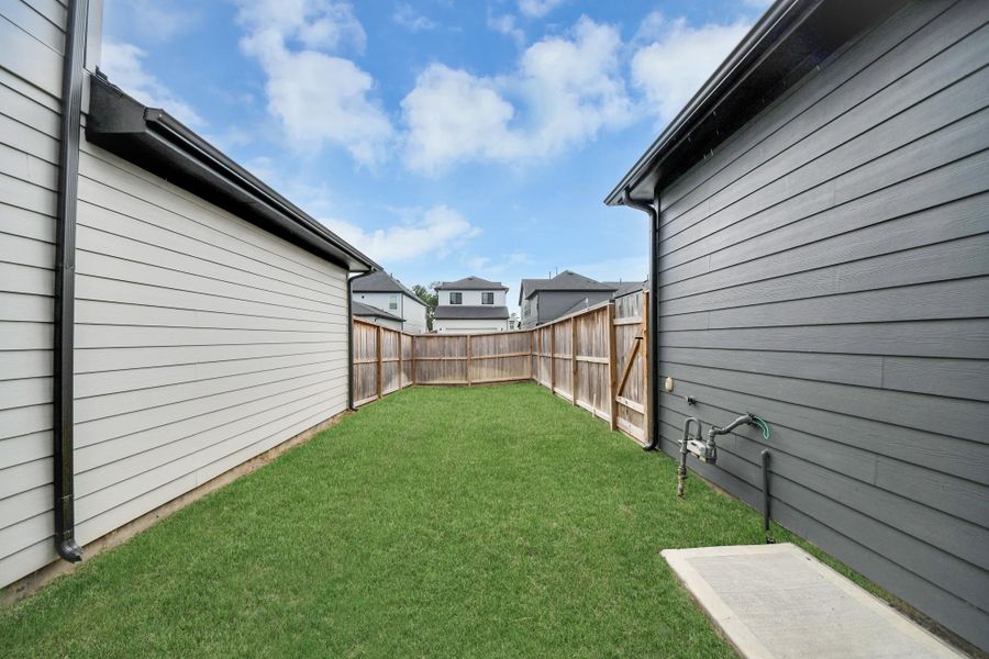 Exterior details and patio area of a home in The Groves 35', Humble (Image 3). Exterior details and patio area of a home in The Groves 35', Humble (Image 3).