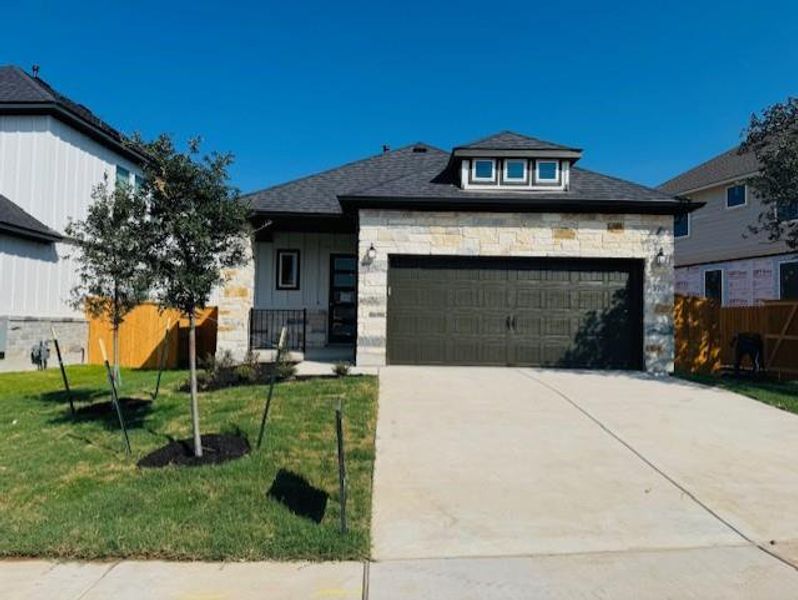 Front exterior of a new home in Heritage, Dripping Springs, TX, highlighting curb appeal (Image 2). Front exterior of a new home in Heritage, Dripping Springs, TX, highlighting curb appeal (Image 2).