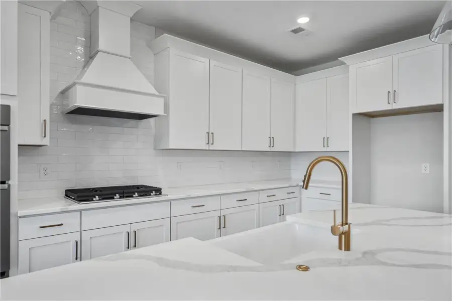 A well-appointed kitchen showcasing a sleek cookto A well-appointed kitchen showcasing a sleek cookto