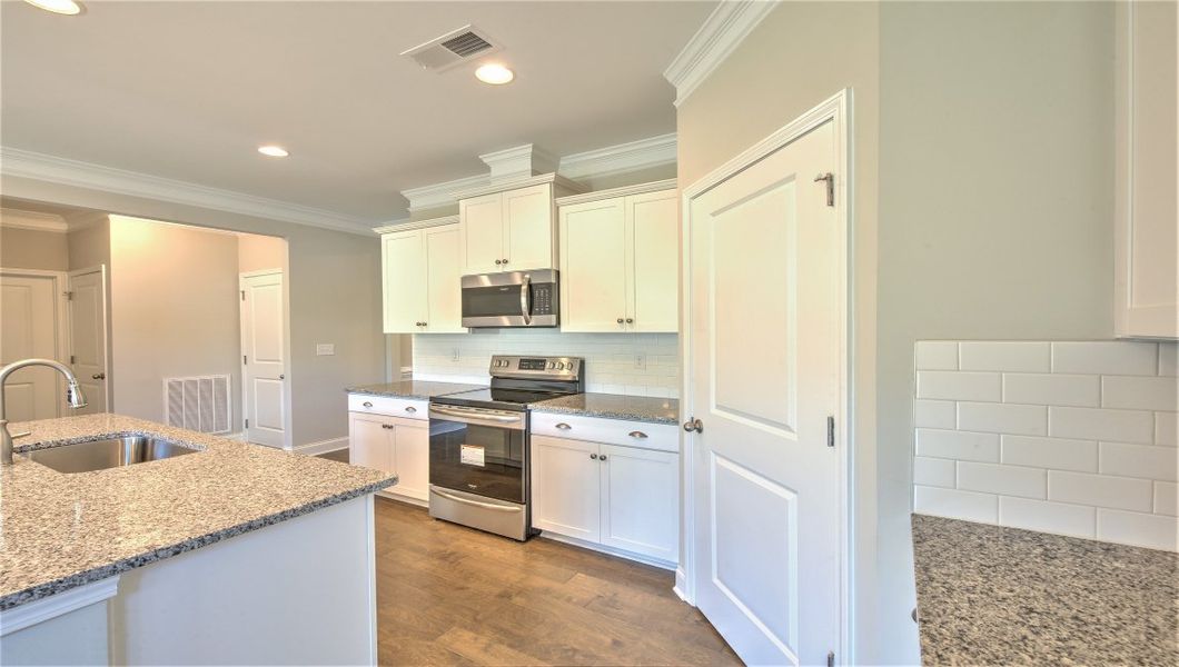 Representative furnished interior of a home built from the ARLINGTON DRHe by D.R. Horton in Valley View, Waynesville (Image 7).